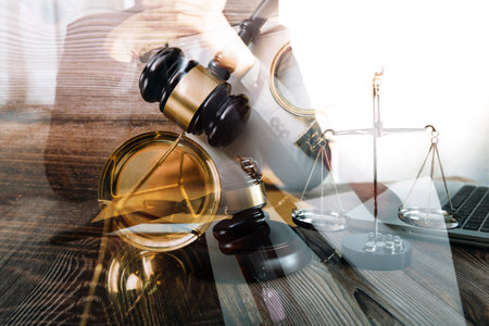 Justice and law concept.Male judge in a courtroom with the gavel, working with, computer and docking...