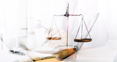 Justice and law concept.Male judge in a courtroom with the gavel, working with, computer and docking...