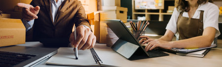 Startup small business entrepreneur or freelance Asian woman using a laptop with box, Young success...