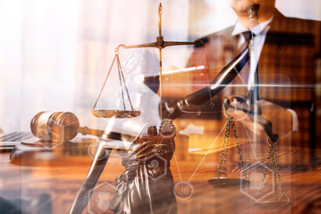 Justice and law concept.Male judge in a courtroom with the gavel, working with, computer and docking...
