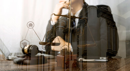 Justice and law concept.Male judge in a courtroom with the gavel, working with, computer and docking...