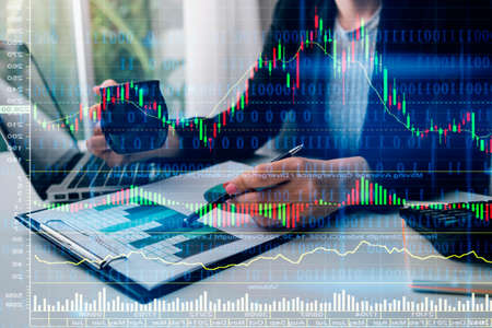 Business People Meeting to analyse and discuss and brainstorming the financial report chart data in...