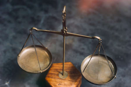 Business and lawyers discussing contract papers with brass scale on desk in office. Law, legal...