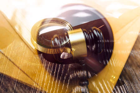 justice and law concept.Male judge in a courtroom on wooden table and Counselor or Male lawyer...