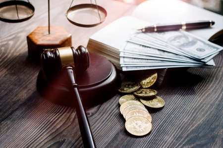 Business and lawyers discussing contract papers with brass scale on desk in office. Law, legal services, advice, justice and law concept picture with film grain effectの写真素材