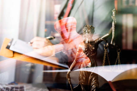 Business and lawyers discussing contract papers with brass scale on desk in office. Law, legal...