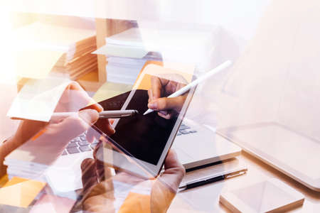 Woman accountant use calculator and computer with holding pen on