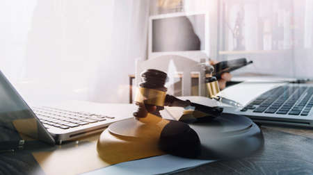 Business and lawyers discussing contract papers with brass scale on desk in office. Law, legal...