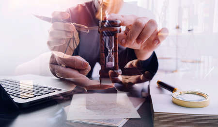 Business and lawyers discussing contract papers with brass scale on desk in office. Law, legal...