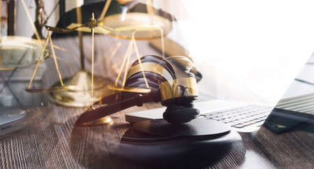 Business and lawyers discussing contract papers with brass scale on desk in office. Law, legal...