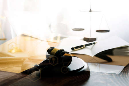 Business and lawyers discussing contract papers with brass scale on desk in office. Law, legal...
