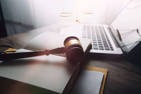 justice and law concept.Male judge in a courtroom on wooden table and Counselor or Male lawyer...