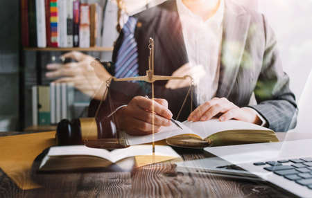 justice and law concept.Male judge in a courtroom on wooden table and Counselor or Male lawyer...