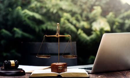 justice and law concept.Male judge in a courtroom on wooden table and Counselor or Male lawyer...