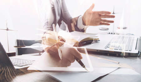 Business and lawyers discussing contract papers with brass scale on desk in office. Law, legal...