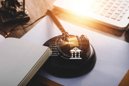 Business and lawyers discussing contract papers with brass scale on desk in office. Law, legal...