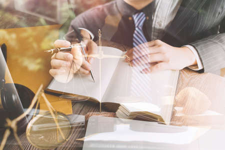 Business and lawyers discussing contract papers with brass scale on desk in office. Law, legal...