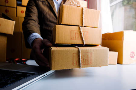 Online sales ideas for work at home. Asian man is answering phone calls. To accept orders from...