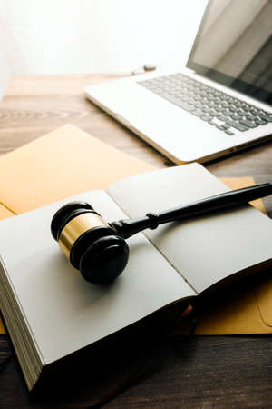 Business and lawyers discussing contract papers with brass scale on desk in office. Law, legal...
