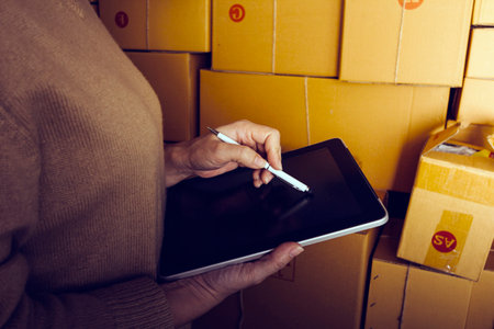 Online sales ideas for work at home. Asian man is answering phone calls. To accept orders from...