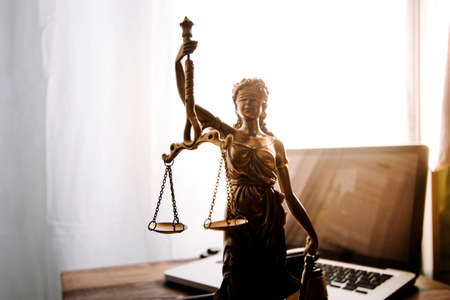 Business and lawyers discussing contract papers with brass scale on desk in office. Law, legal...