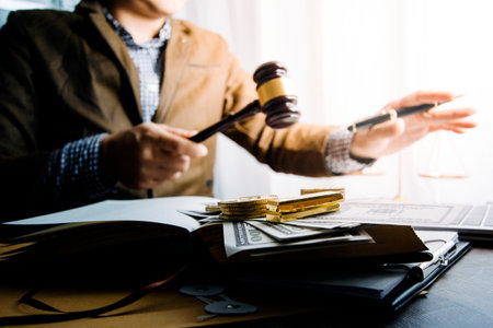 justice and law concept.Male judge in a courtroom on wooden table and Counselor or Male lawyer...