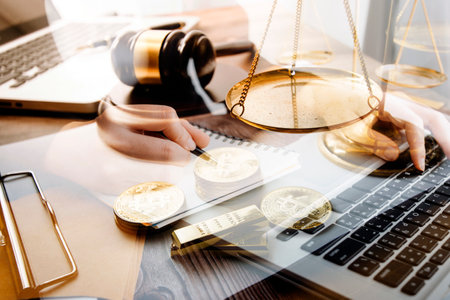 Justice and law concept.Male judge in a courtroom with the gavel, working with, computer and docking...
