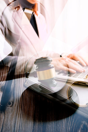 justice and law concept.Male judge in a courtroom on wooden table and Counselor or Male lawyer...