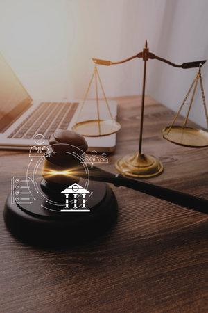 Justice and law concept.Male judge in a courtroom with the gavel, working with, computer and docking...