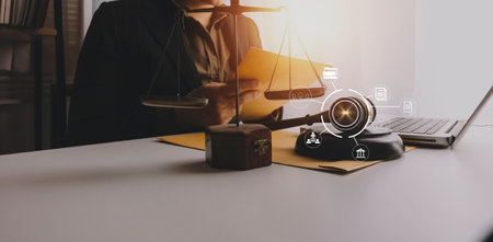 Justice and law concept.Male judge in a courtroom with the gavel, working with, computer and docking...