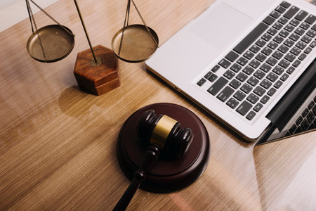 Business and lawyers discussing contract papers with brass scale on desk in office. Law, legal...