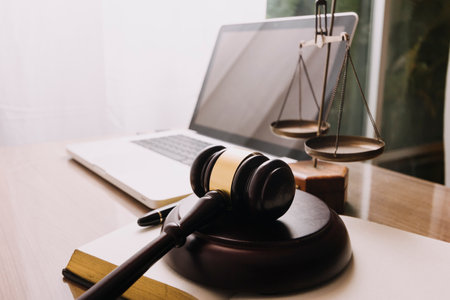 Business and lawyers discussing contract papers with brass scale on desk in office. Law, legal...