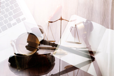justice and law concept.Male judge in a courtroom on wooden table and Counselor or Male lawyer...