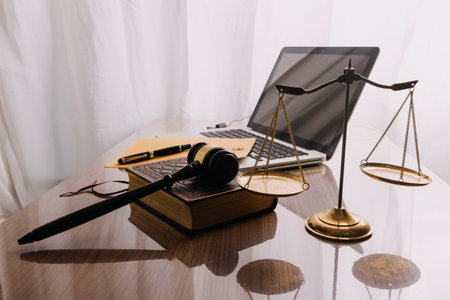 Business and lawyers discussing contract papers with brass scale on desk in office. Law, legal...