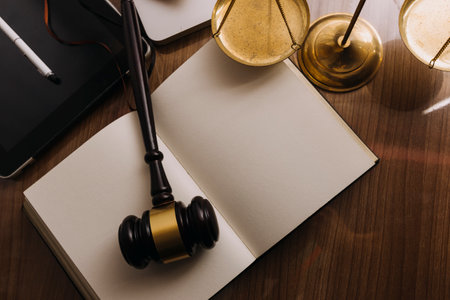 Business and lawyers discussing contract papers with brass scale on desk in office. Law, legal...