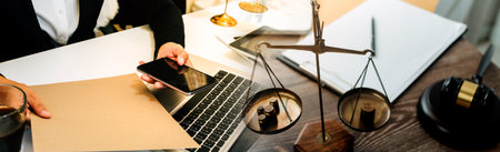 Business and lawyers discussing contract papers with brass scale on desk in office. Law, legal...