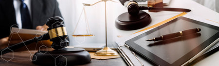 Business and lawyers discussing contract papers with brass scale on desk in office. Law, legal...