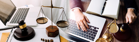 Business and lawyers discussing contract papers with brass scale on desk in office. Law, legal...