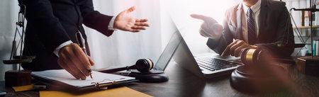Business and lawyers discussing contract papers with brass scale on desk in office. Law, legal...