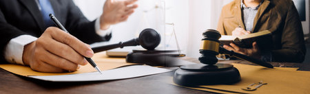 Justice and law concept.Male judge in a courtroom with the gavel, working with, computer and docking...