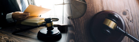 Business and lawyers discussing contract papers with brass scale on desk in office. Law, legal...