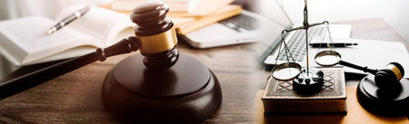Justice and law concept.Male judge in a courtroom with the gavel, working with, computer and docking...