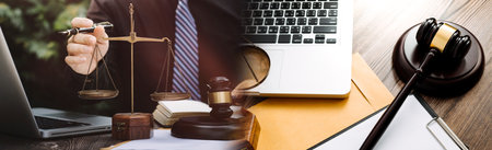 Business and lawyers discussing contract papers with brass scale on desk in office. Law, legal...