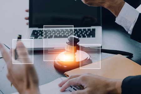 Justice and law concept.Male judge in a courtroom with the gavel, working with, computer and docking...