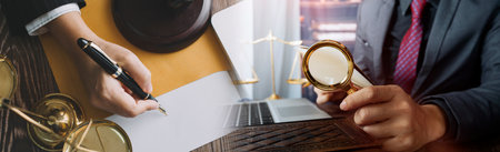 Business and lawyers discussing contract papers with brass scale on desk in office. Law, legal...