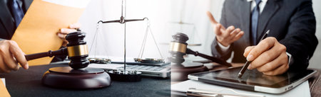 Business and lawyers discussing contract papers with brass scale on desk in office. Law, legal...