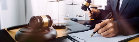 Business and lawyers discussing contract papers with brass scale on desk in office. Law, legal...