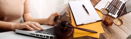 Business and lawyers discussing contract papers with brass scale on desk in office. Law, legal...
