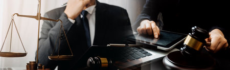 Male lawyer working with contract papers and wooden gavel on tabel in courtroom. justice and law...