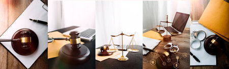 Justice and law concept.Male judge in a courtroom with the gavel, working with, computer and docking keyboard, eyeglasses, on table in morning lightの写真素材